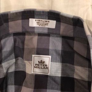 Men’s long sleeved checkered dress shirt.